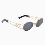 Side view | Oval sunglasses with black lenses and gold frames | Metal | Carrie | Women's sunglasses | Karen Wazen Eyewear