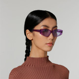 Side view of model wearing sunglasses | Cat-like sunglasses with purple lenses and purple frames | Acetate | Dixy | Women's sunglasses | Karen Wazen Eyewear