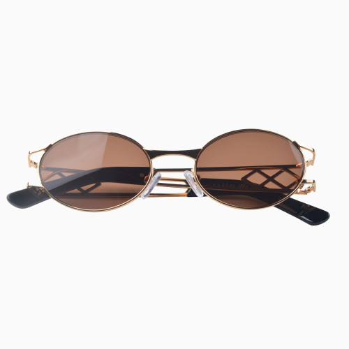 Front view | Oval sunglasses with brown lenses and gold frames | Metal | Carrie | Women's sunglasses | Karen Wazen Eyewear