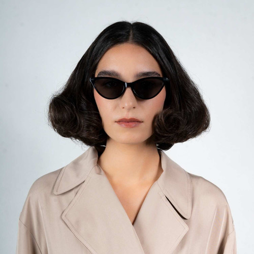 Front view of model wearing sunglasses | Cat-like sunglasses with black lenses and black frames | Metal & Acetate | Kourt | Women's sunglasses | Karen Wazen Eyewear