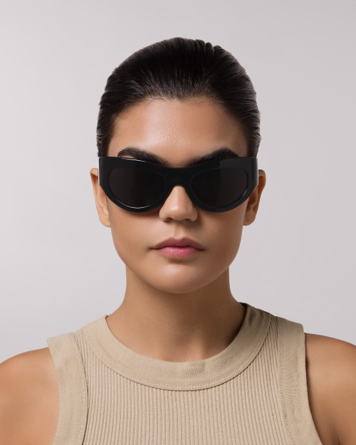 Front of model wearing sunglasses | Mask sunglasses with black lenses and black frames |  Acetate | Swim | Women's sunglasses | Karen Wazen Eyewear
