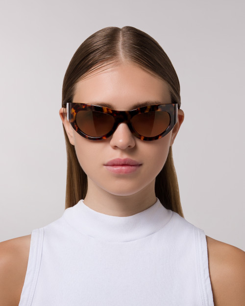 Front view of model wearing sunglasses  | Mask sunglasses with tortoise lenses and tortoise frames |  Acetate | Swim | Women's sunglasses | Karen Wazen Eyewear