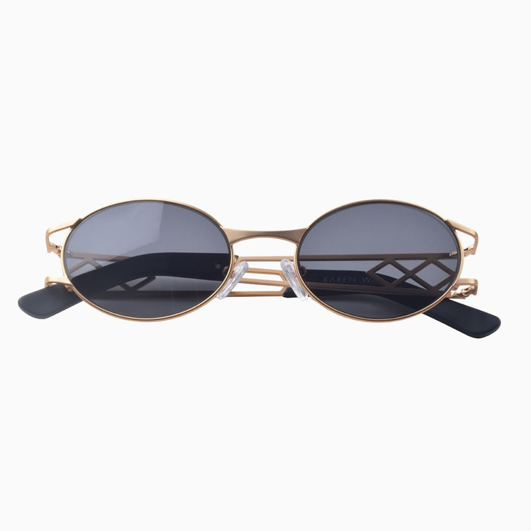 Front view | Oval sunglasses with black lenses and gold frames | Metal | Carrie | Women's sunglasses | Karen Wazen Eyewear