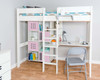 white loft bed with desk and 2 cube storage units that have pink doors