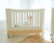 Baby in the white & natural colour cot bed