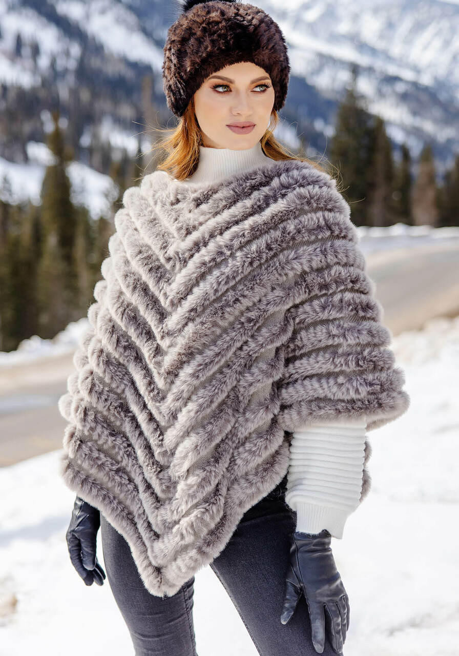 https://cdn11.bigcommerce.com/s-g5q766vios/images/stencil/1280x1280/products/2460/14608/natural-faux-fur-deluxe-knitted-poncho__23576.1668167966.jpg?c=1