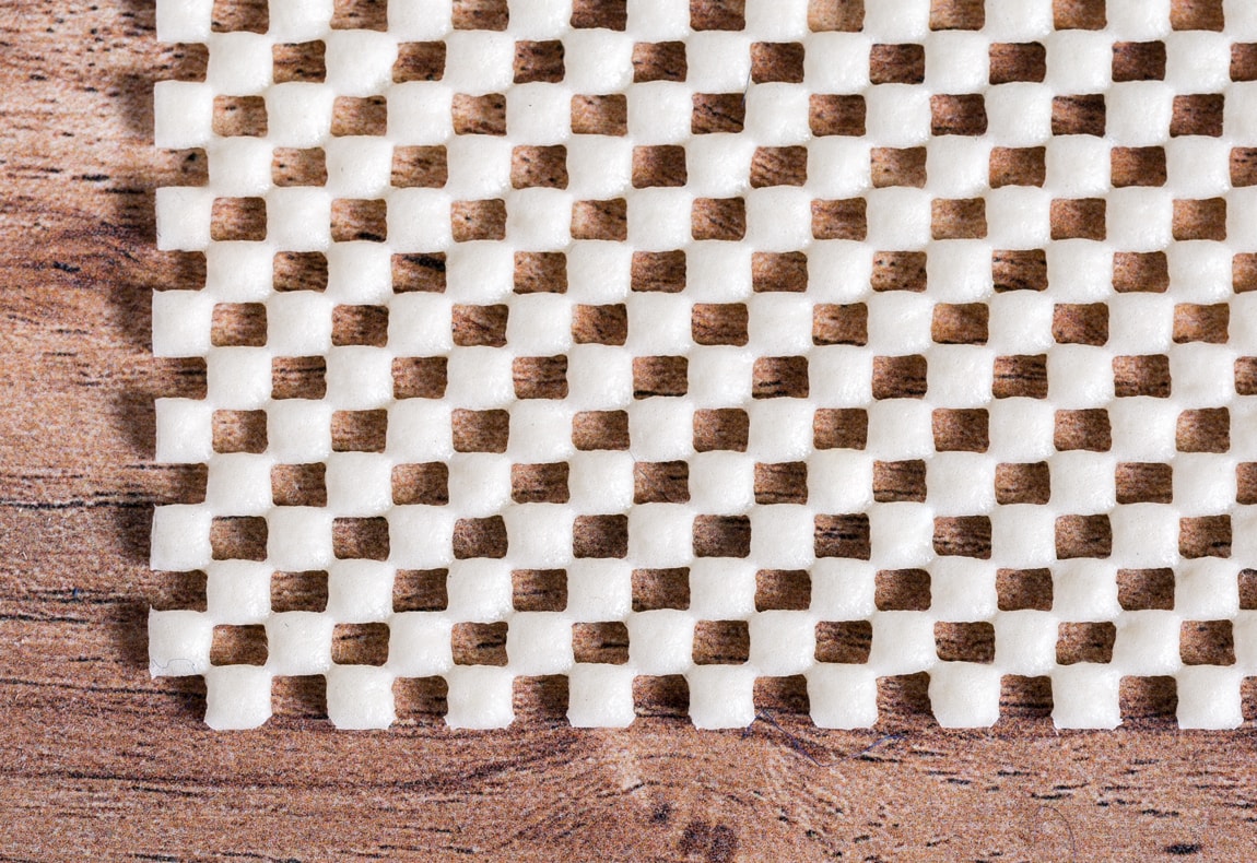 a close-up of the checkered structure of the rug pad