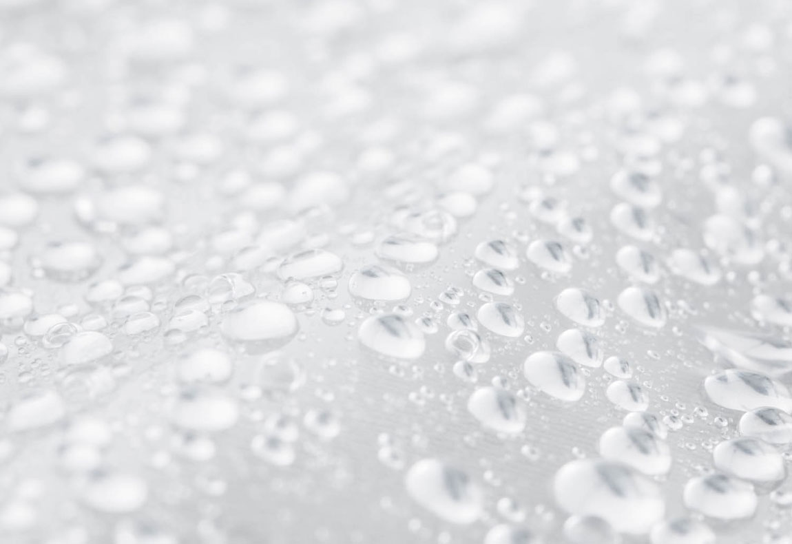 a close-up of the bag material with water droplets beading up on it