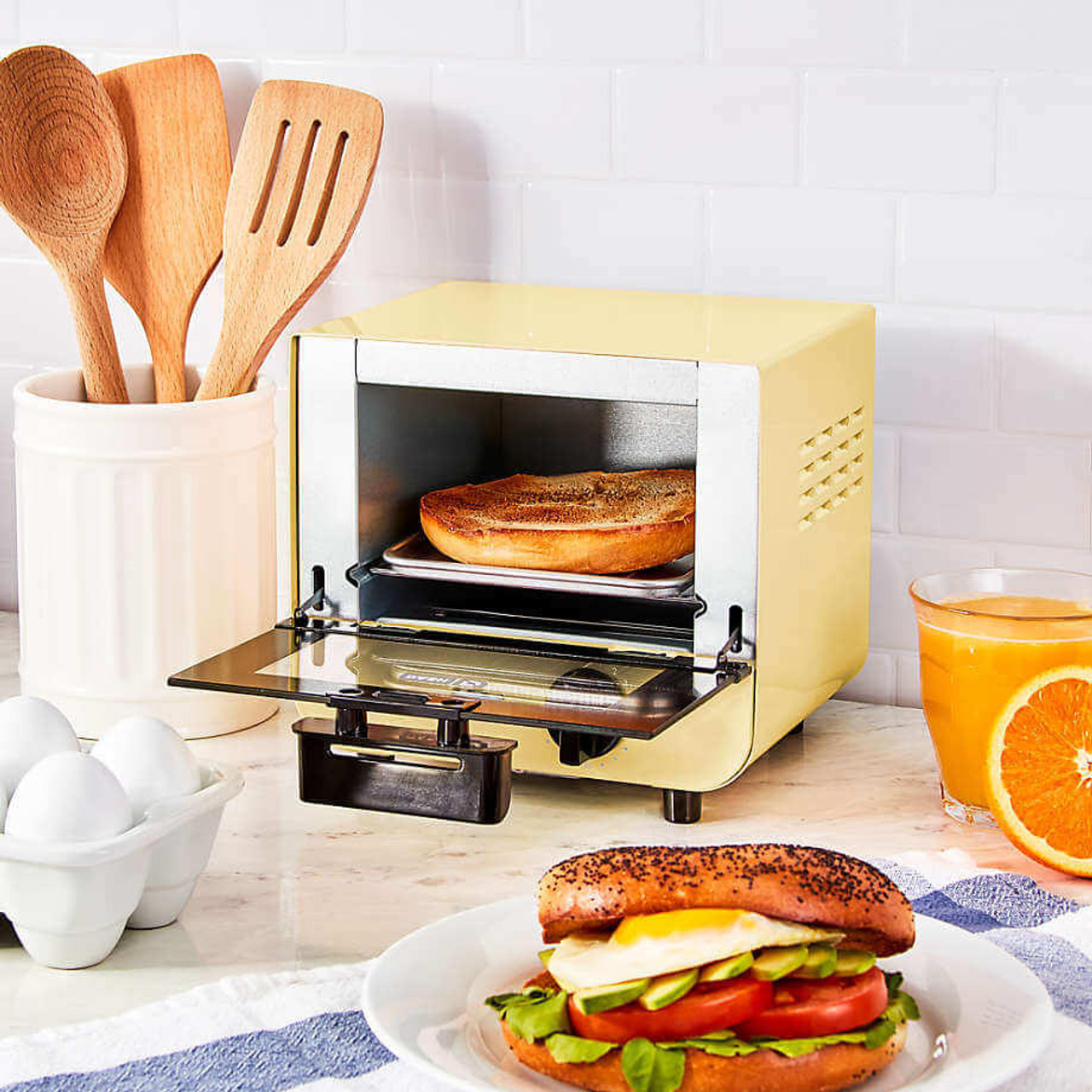 https://cdn11.bigcommerce.com/s-g5ygv2at8j/images/stencil/1280x1280/products/13929/31463/dash-dash-mini-countertop-toaster-oven-7.2-x-6.3-x-7.7-3.2-lbs__74255.1689644641.jpg?c=1
