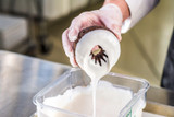  Rich's Classic White Donut & Roll Icing - 23 lb. Pail with Timeless Elegance 