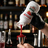 Real 16.9 fl. oz. Strawberry Puree Infused Syrup - Sweet Strawberry Flavor - Chicken Pieces
