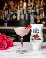 Real 16.9 fl. oz. Raspberry Puree Infused Syrup - Sweet and Tart Flavor - Chicken Pieces