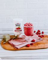 Real 16.9 fl. oz. Raspberry Puree Infused Syrup - Sweet and Tart Flavor - Chicken Pieces