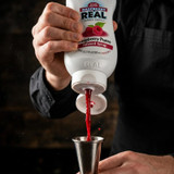 Real 16.9 fl. oz. Raspberry Puree Infused Syrup - Sweet and Tart Flavor - Chicken Pieces