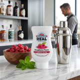 Real 16.9 fl. oz. Raspberry Puree Infused Syrup - Sweet and Tart Flavor - Chicken Pieces