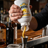 Real 16.9 fl. oz. Banana Puree Infused Syrup - Sweet Creamy Tropical Flavor - Chicken Pieces