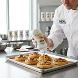 Real 16.9 fl. oz. Banana Puree Infused Syrup - Sweet Creamy Tropical Flavor - Chicken Pieces