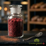 gourmet-red-velvet-donut-topped-with-yum-crumbs-and-cream-cheese-glaze