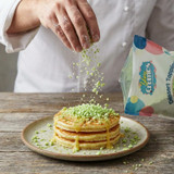 gourmet-white-chocolate-pistachio-donut-topped-with-yum-crumbs