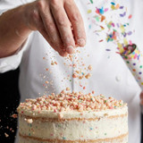 gourmet-birthday-cake-donut-topped-with-yum-crumbs-and-vanilla-glaze