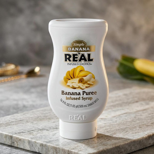 Real 16.9 fl. oz. Banana Puree Infused Syrup - Sweet Creamy Tropical Flavor - Chicken Pieces