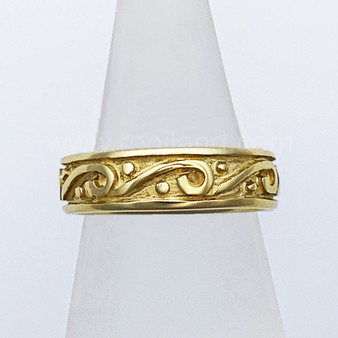 The Glenna is a solid rimmed band with scrolls and beads all the way around. Shown in 14kt Yellow gold.