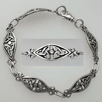 Link bracelet featuring trinity knots flanking a central bead in an almond shape frame.