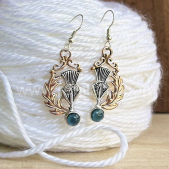 The Cirsium Gem Earrings feature thistles, leaves and 6mm gems. Shown in rose gold & sterling with London Blue Topaz.