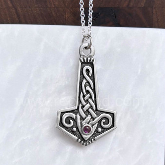 The Reithe Gem Hammer features knotwork and a 4mm gemstone. Shown with Amethyst.