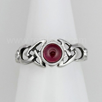 The Ribean Gem Ring has a 6mm gemstone, triangular pierced knotwork and a grooved back. Shown with Garnet.