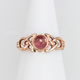 The Ribean Gem Ring has a 6mm gemstone, triangular pierced knotwork and a grooved back. Shown in rose gold with Pink Tourmaline.