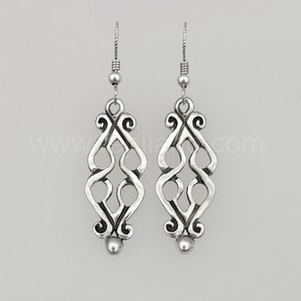 The Fadó Knot Earrings are formed from two overlapping heart shapes with curled ends and large bead accents at the bottom.