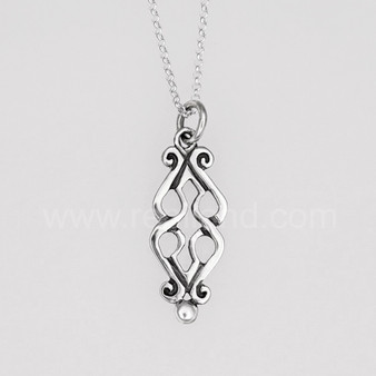 The Fadó Knot Pendant is formed from two overlapping heart shapes with curled ends and large bead accents at the bottom.