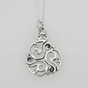 The Inishglora Triskele Pendant features an intricate, openwork circular design based on a traditional triskele motif.