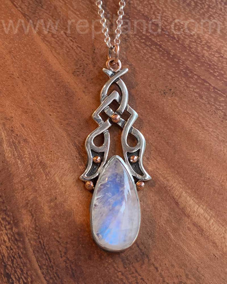 Sterling & 14kt rose gold pendant with 22.31ct Rainbow Moonstone.