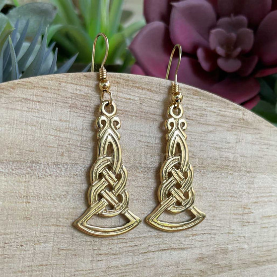 The Brigantia Knot Earrings have intricate, grooved knot work. Shown in 14kt Yellow Gold.