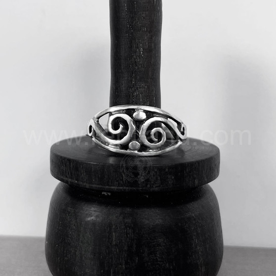 The Theia Ring features an almond shape frame with pierced silver swirls and bead accents.