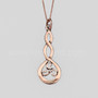 The Grian Triskele Pendant features a graceful twist drop with a triskele. Shown in 14kt rose gold.