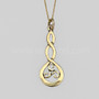 The Grian Triskele Pendant features a graceful twist drop with a triskele. Shown in 14kt yellow gold.
