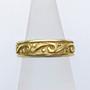 The Glenna is a solid rimmed band with scrolls and beads all the way around. Shown in 14kt Yellow gold. The Glenna is a solid rimmed band with scrolls and beads all the way around. Shown in 14kt Yellow gold.