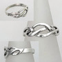 The Mwynen Knot Ring has curving pierced knotwork. With side views.