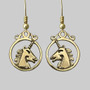 The Dìleab Earrings have a unicorn head in profile within a circle frame. Shown in 14kt yellow gold.