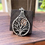 The Bard Owl Tree Pendant in sterling with rose gold moon.