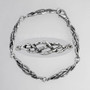 The Rùsg Knot Bracelet has knotwork links textured to look like treebark.