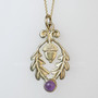 The Flora Gem Pendant features curving oak leaves, a capped acorn and 6mm gemstone. Shown in yellow gold with Amethyst.