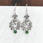 The Flora Gem Earrings feature curving oak leaves,  capped acorns and 6mm gemstones. Shown with Green Agates.