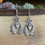 The Grizel Earrings feature a capped acorn framed with oak leaves.