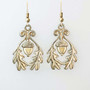 The Grizel Earrings feature a capped acorn framed with oak leaves. Shown in yellow gold.