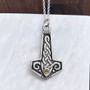 The Reithe Gem Hammer features pierced knotwork and a 4mm gemstone. Shown with Citrine.
