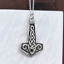 The Reithe Gem Hammer features knotwork and a 4mm gemstone. Shown with Onyx.